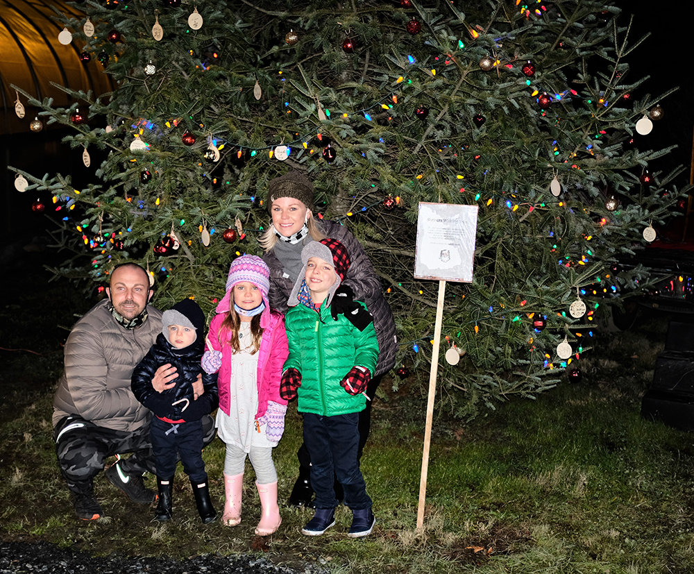 John and Meghan Pignatalli brought their children, L-R Hunter, Halia and Jackson, to visit with Santa and to see the tree lit up.
